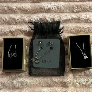 Great for gifting!! NEW. 2 Adjustable necklaces 3rd necklace/matching earrings.